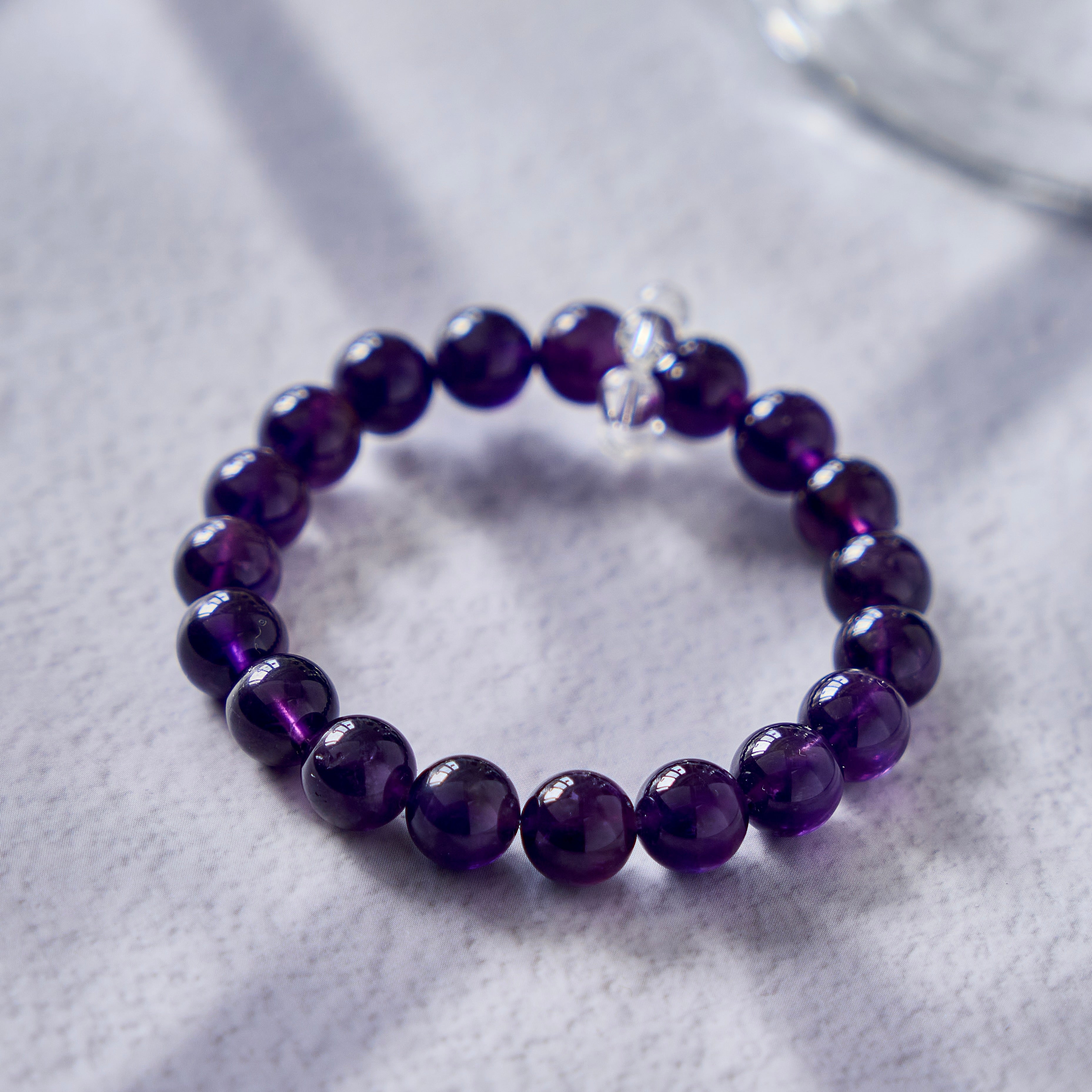 Midnight Violet – Amethyst Bracelet with Clear Quartz Accent | Calm · Intuition · Protection