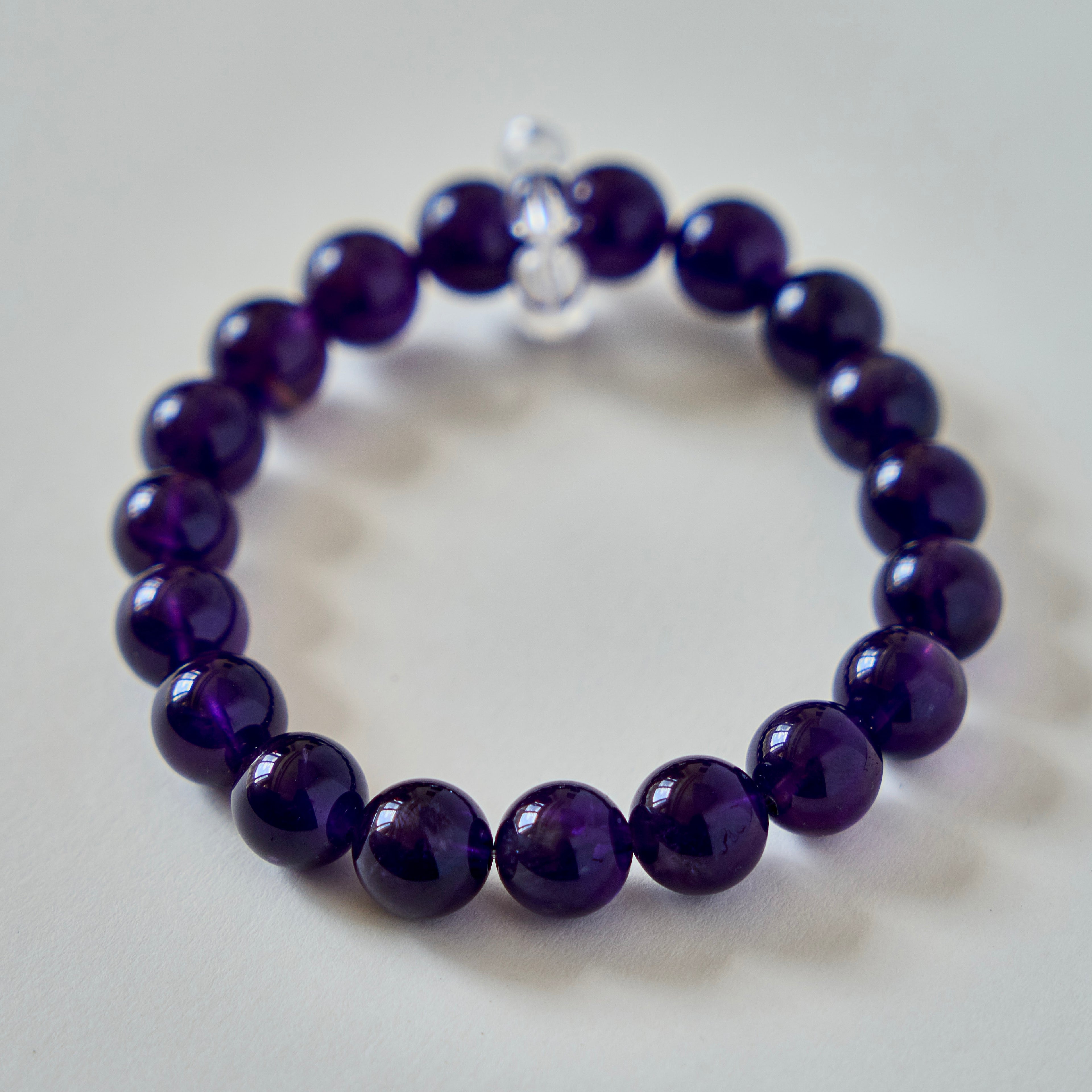 Midnight Violet – Amethyst Bracelet with Clear Quartz Accent | Calm · Intuition · Protection